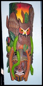 wood carved owl and snake
